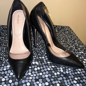 Black Aldo closed-toe heels.